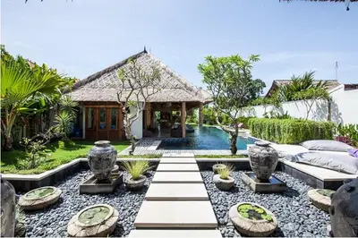 a villa with a swimming pool and a resort at Villa Katapappa in Seminyak