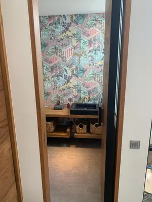a door leading into a room with a wallpaper at Villa MOSAIC - Stunning Designed Spacious Villa - Center Canggu in Canggu