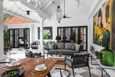 a living room with a couch and a table at Villa Nago Walk to Seminyak Best Spots in Seminyak