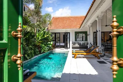 a swimming pool in the backyard of a villa at Villa Nago Walk to Seminyak Best Spots in Seminyak