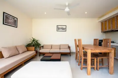 a living room with a couch and a table at Taman Sari Pengubengan Villa in Kerobokan