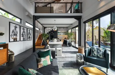 a living room with a couch and a table at Summer House Villa in Canggu