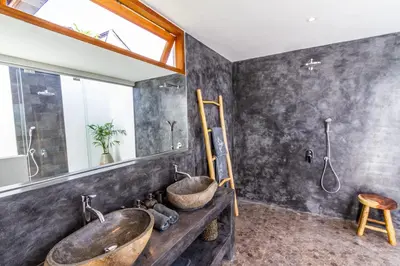 a bathroom with two sinks and a mirror at Villa Hana by Alfred in Bali in Seminyak