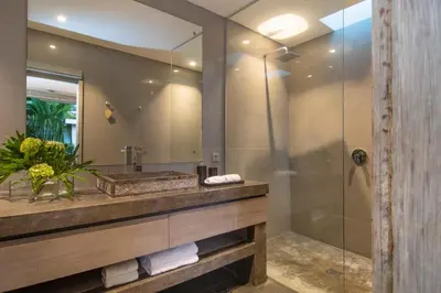 a bathroom with a sink and a shower at Villa Mia by Villa Finder in Canggu