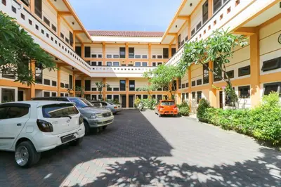 a parking lot in front of a building at Permisol Homestay 88 in Denpasar