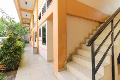 a staircase in a building with a stair case at Permisol Homestay 88 in Denpasar