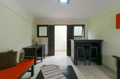 a living room with a couch and a table at Permisol Homestay 88 in Denpasar