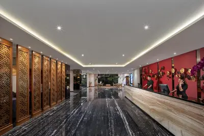 a lobby of a hotel with a dance floor at Four Star by Trans Hotel in Sanur