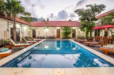 an image of a swimming pool in front of a house at KELAN-TEL BALI in Jimbaran