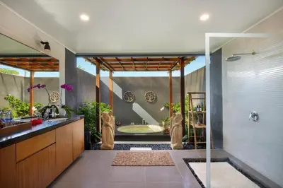 a bathroom with a shower and a bath tub at Huge 11 BR Villa, Sleeps 41, Prime Area, Near Beach in Canggu