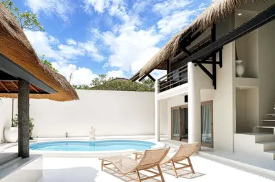a pool in the backyard of a villa at Villa de Malicott in Seminyak