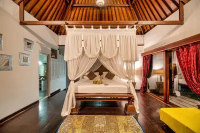 a bedroom with a bed with a canopy at Luxury Villa La plancha BEACH 200m, Heart of Seminyak in Seminyak