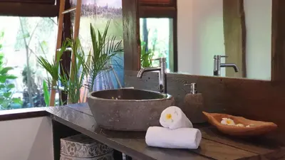 a bathroom counter with a sink and a mirror at Luxury Villa La plancha BEACH 200m, Heart of Seminyak in Seminyak