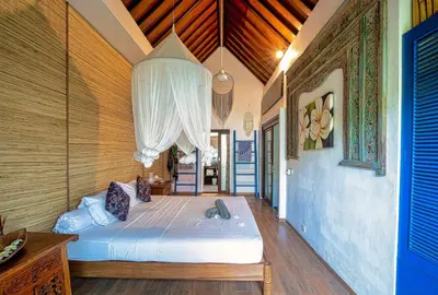 a bedroom with a bed in a room at Luxury Villa La plancha BEACH 200m, Heart of Seminyak in Seminyak