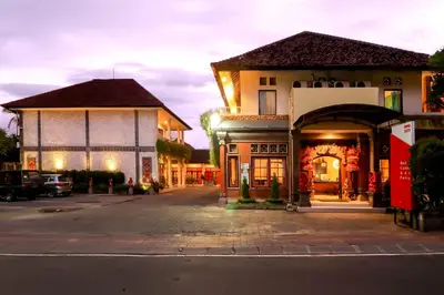 a group of buildings on a city street at Catur Adi Putra in Denpasar