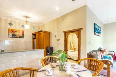 a dining room with a table and chairs at Villa Retro 88 in Seminyak