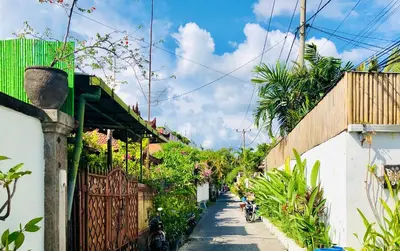 an alley with motorcycles parked on the side of a house at Villa Retro 88 in Seminyak