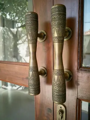 two handles of a door with henna on it at Villa Brabhan Seminyak in Seminyak