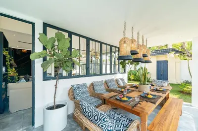 a living room with a table and a couch at Luxe 5 Bed, Sleeps 10, Butler, Walk to ShopsCafe in Seminyak