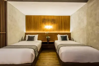 a room with two beds in a room at Kuta Legian Villa 3 Bedroom Private pool in Legian