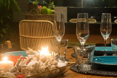 a table with candles and wine glasses on a table at 3BR Villa Olli - Minggu Villas -Special Stay Bonus in Kerobokan