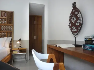 a bedroom with a desk with a chair and a bed at 3BR Villa Olli - Minggu Villas -Special Stay Bonus in Kerobokan