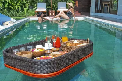 a tray of food in a swimming pool at 2BR Villa Michelle - Minggu Villas - Special Stay Bonus in Kerobokan