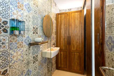 a bathroom with a sink and a mirror at Radea Villa in Kerobokan