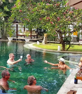 a group of people in a swimming pool at Villa Maharaj in Seminyak