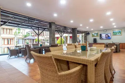 a dining room with a table and chairs at Vidi Boutique Hotel in Nusa Dua