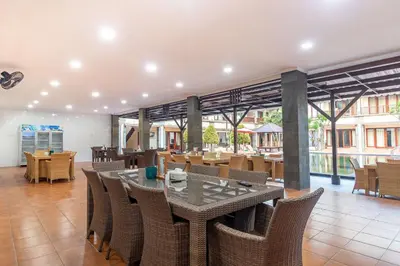 a dining room with a table and chairs at Vidi Boutique Hotel in Nusa Dua