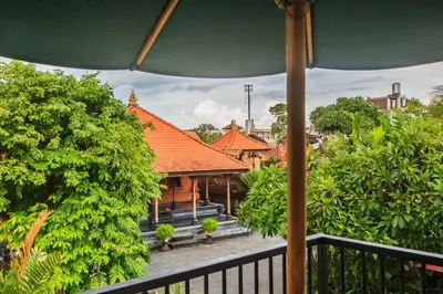 a view of a house from a balcony at The jero 18 kuta guest house in Kuta