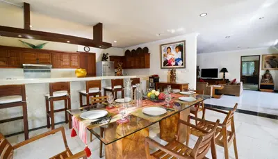 a kitchen and dining room with a table and chairs at Villa Bali Maja - Beautiful Private Pool Villa in Petitenget, Seminyak in Seminyak