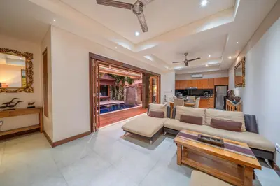 a living room with a couch and a table at Villa Seacluded 1 - 3BR Villa in Central Seminyak - Large Pool in Seminyak
