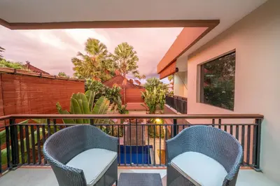 two chairs on the balcony of a house at Villa Seacluded 1 - 3BR Villa in Central Seminyak - Large Pool in Seminyak