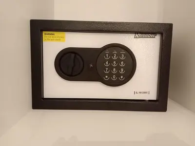 a remote control in a picture on a wall at Simple Kuta Bedroom in Kuta