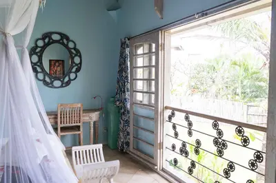 a room with a large window and a door at Villa Noretsy in Seminyak