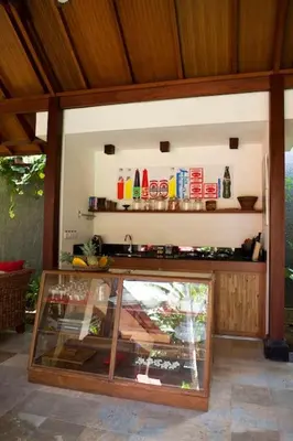 a shop with a glass display case in a room at Mango Tree Villas Jimbaran Bali in Jimbaran