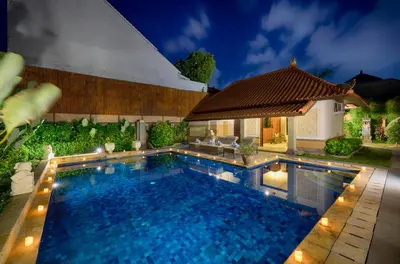 a swimming pool in a yard with a house at Villa Deh Simba at Oberoi in Seminyak