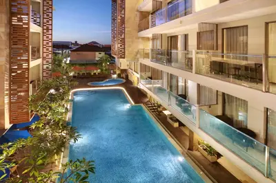 an overhead view of a swimming pool in a building at Harper Kuta Hotel by ASTON in Legian