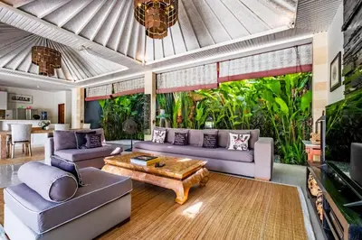 a living room with a couch and a table at Central Seminyak Villa Martini in Seminyak