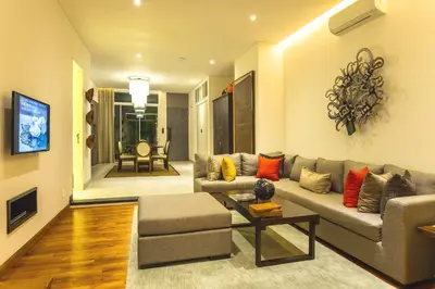 a living room with a couch and a table at hu'u Villas in Seminyak