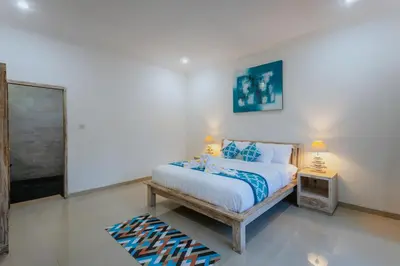 a bedroom with a bed and a tv in it at Villa Cathy, Seminyak - Private 3 Bedroom Pool Villa! in Seminyak