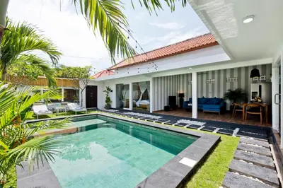 a swimming pool in the backyard of a villa at La Fortuna in Seminyak