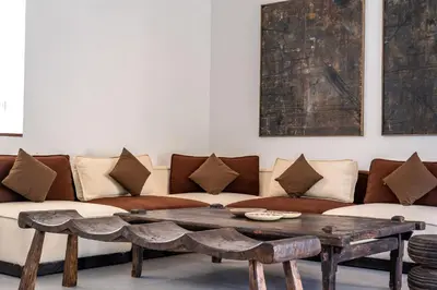 a living room with a couch and a coffee table at Villa WoW Canggu in Canggu