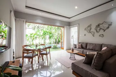 a living room with a couch and a table at Villa Voyage 4 in Seminyak