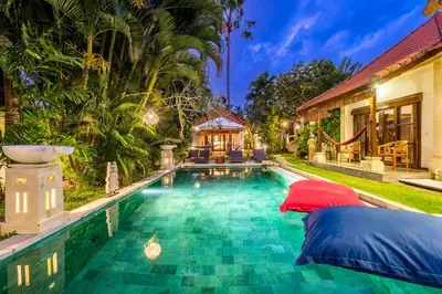 a swimming pool in the backyard of a house at Madu Villa Seminyak in Seminyak