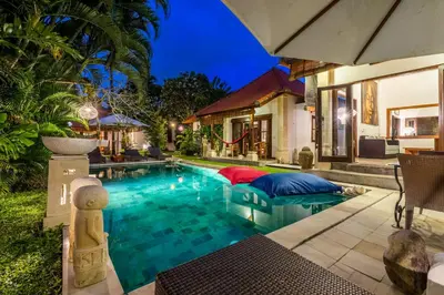 a swimming pool in the backyard of a house at Madu Villa Seminyak in Seminyak