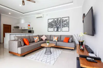 a living room with a couch and a table at Villa Voyage 5 in Seminyak