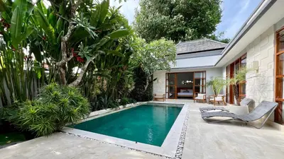 a swimming pool in the backyard of a house at Villa Voyage 5 in Seminyak